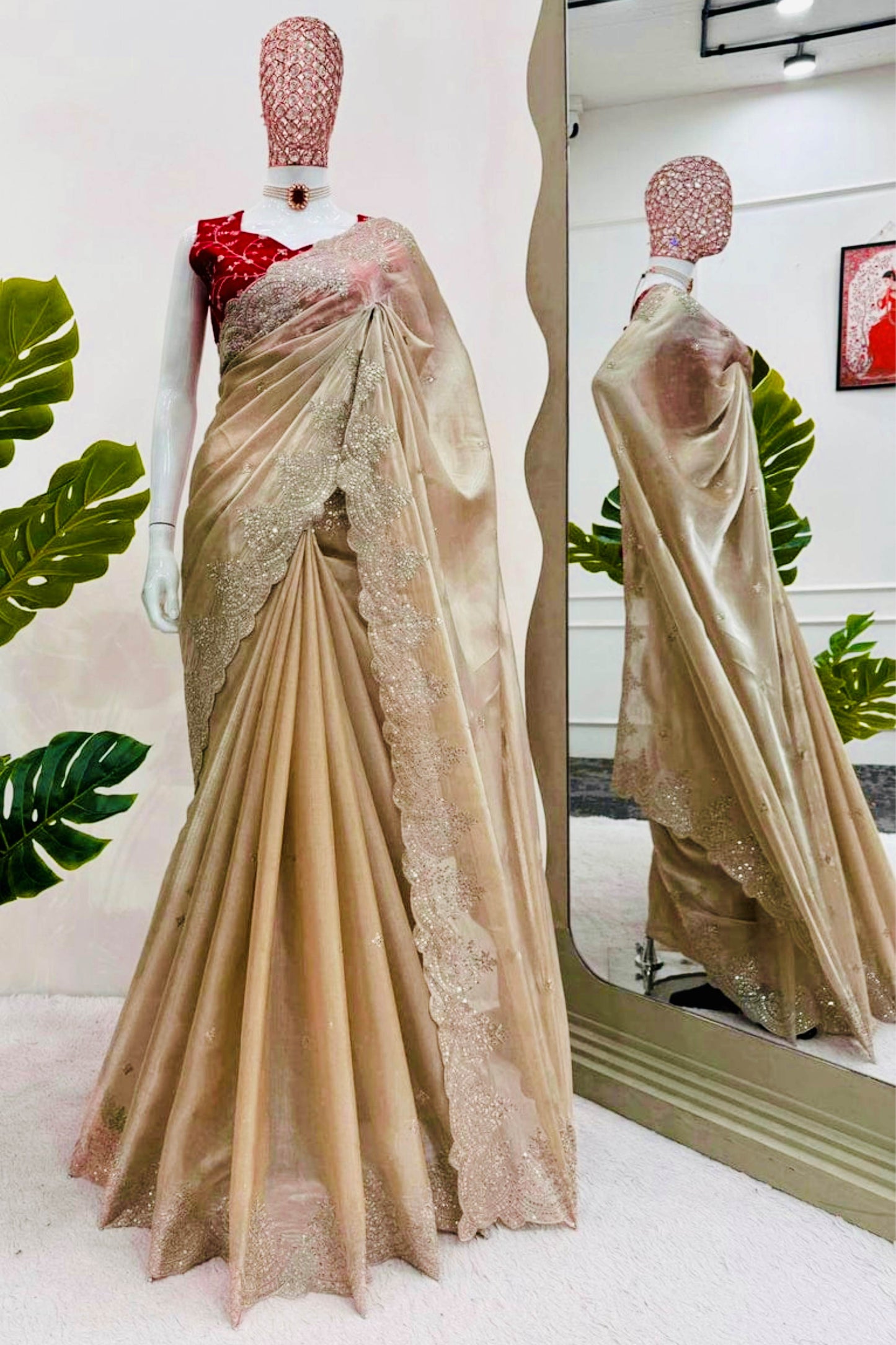 Dark Ivory Shimmery Tissue Silk Saree with Red Embroidered Sleeveless readymade Blouse