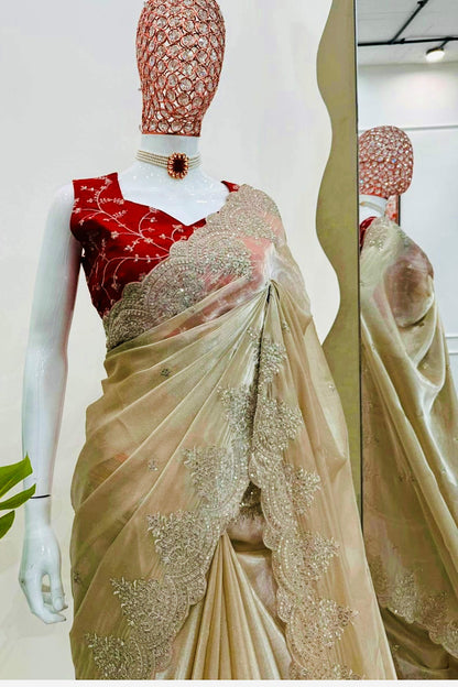 Dark Ivory Shimmery Tissue Silk Saree with Red Embroidered Sleeveless readymade Blouse